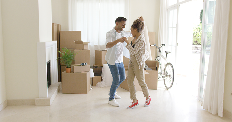 couple dancing in their new home