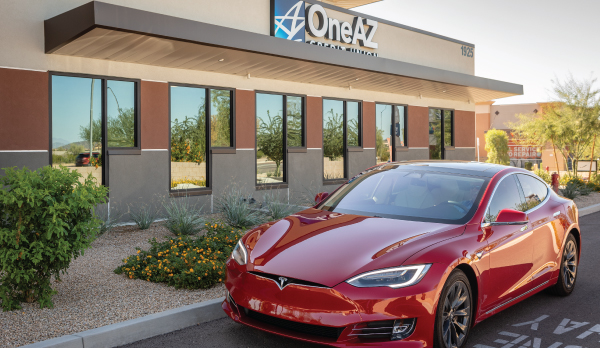 red Tesla outside of OneAZ Credit Union