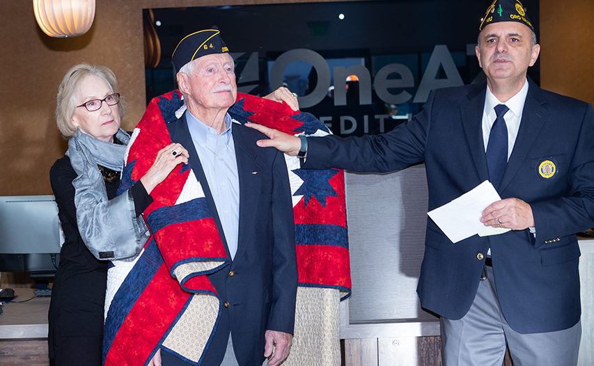 Steve Didio presenting the  Quilt of Valor to Vern Luther, quilt made by Marianne Woodside