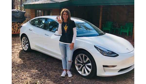 Steve's wife with the keys to their new Tesla.