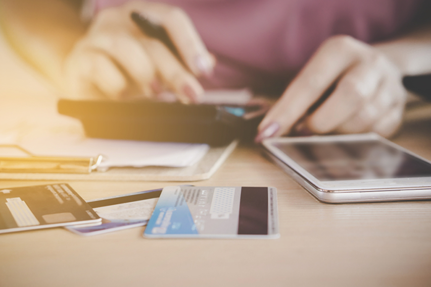 Woman calculates credit card debt