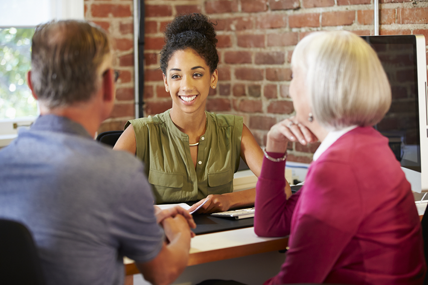 Trusted financial partner meets with couple
