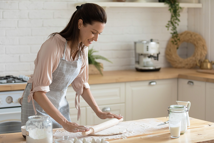 woman baking bread at home