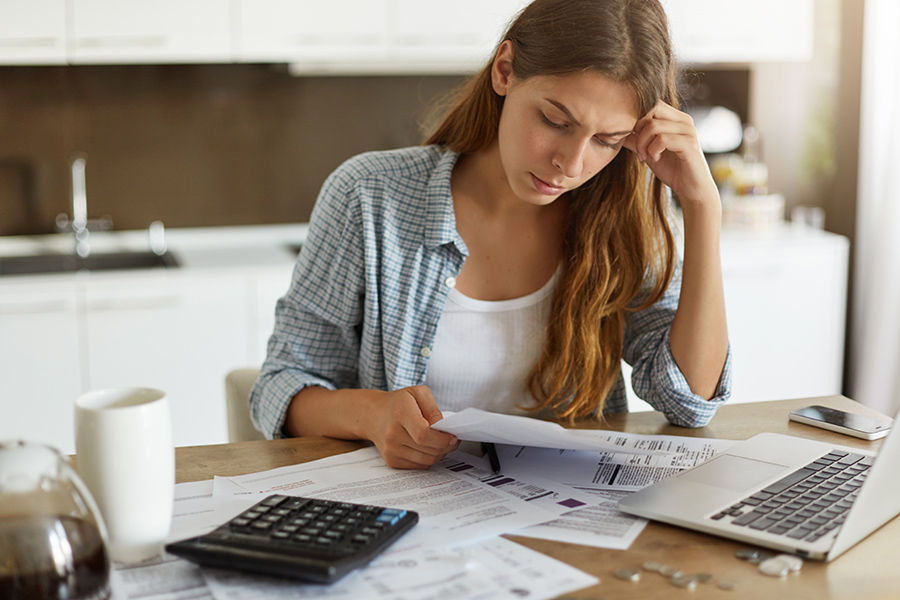 woman going over bills at home