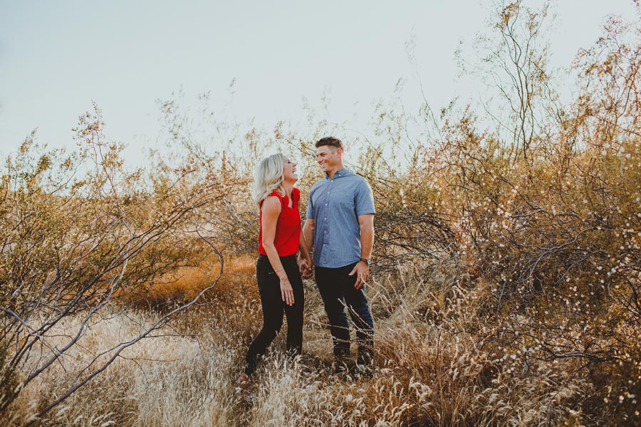 Andrea and Chris laughing in a field