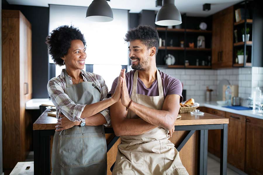 high fiving in the kitchen