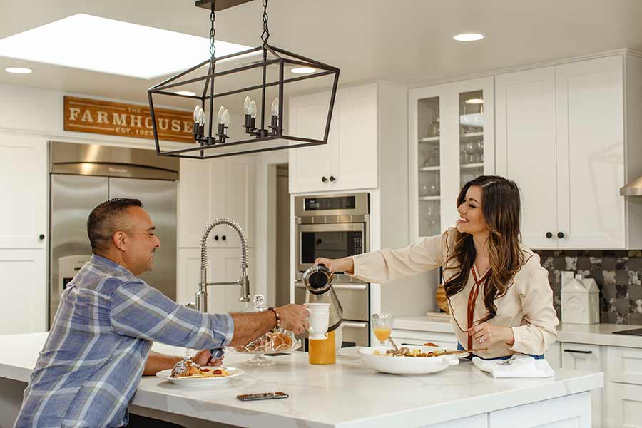 couple having brunch in the kitchen of their newly refinanced home