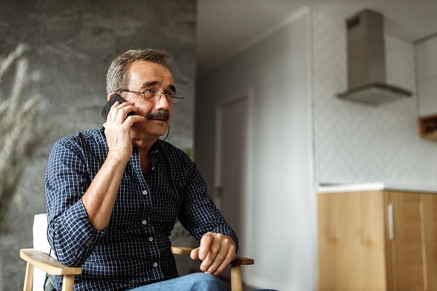 man discussing his options with a creditor over the phone