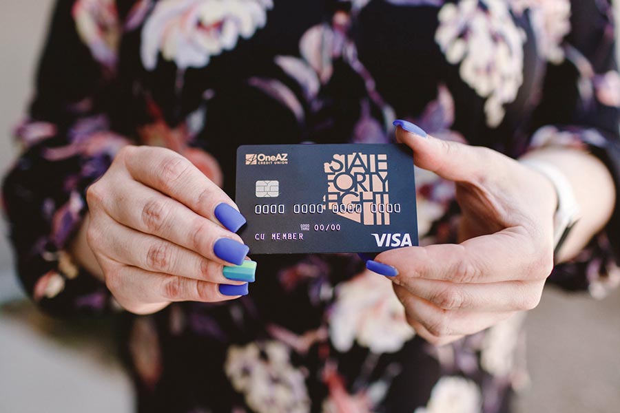 OneAZ member proudly showing off their State Forty Eight Visa credit card.