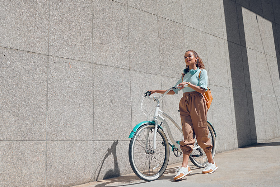 woman walking with bike