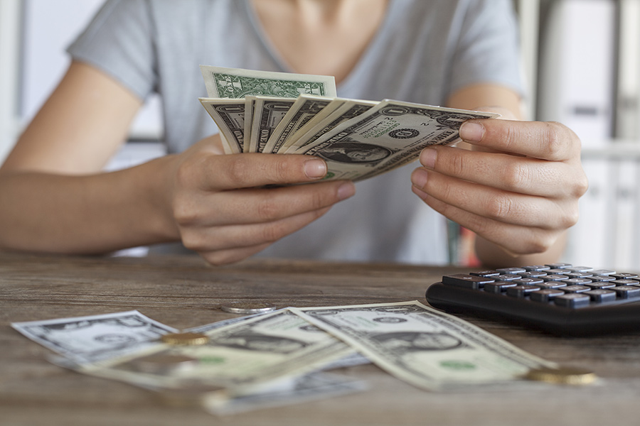 Person Counting Cash and Coins. How does compound interest work?