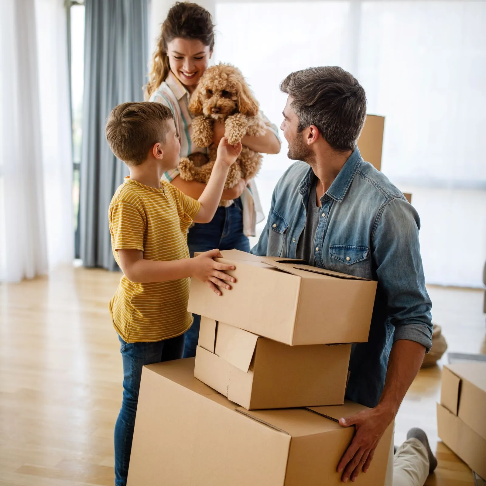 Family With Boxes Moving Into New Home 1600X1600