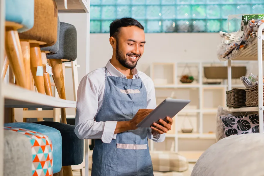 Small Business Owner With The Tablet 900X600