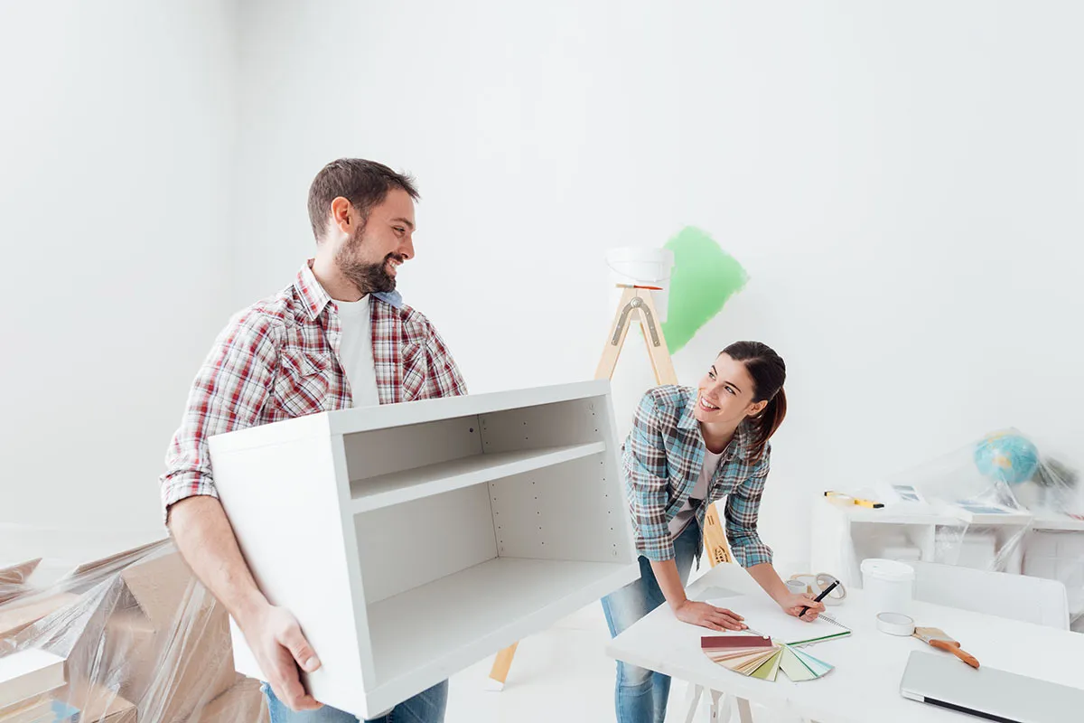 couple remodeling a room in their house together